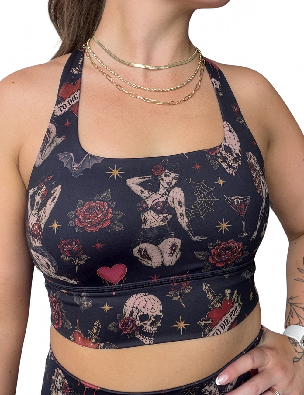 front of the zombie girls with pin up hair and traditional tattoo designs bra against a white background