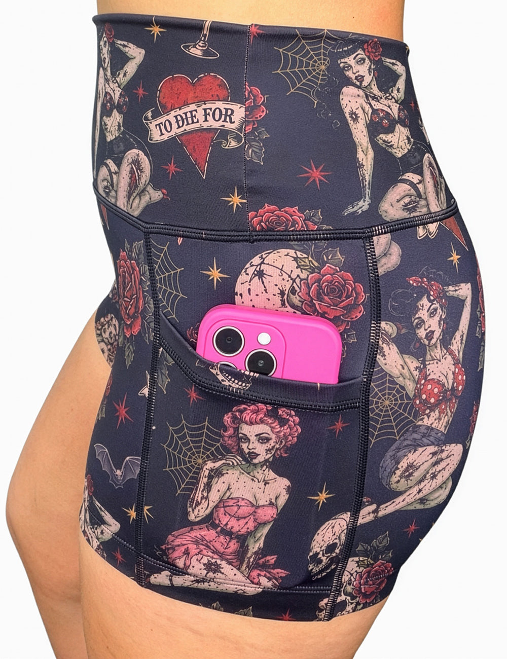 close up of the 2.5 inch zombie girls with pin up hair and traditional tattoo designs shorts with a phone in its pocket