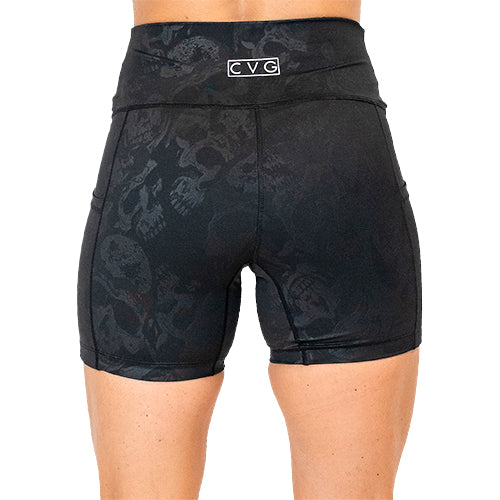 back view of black on black skull print 5 inch shorts