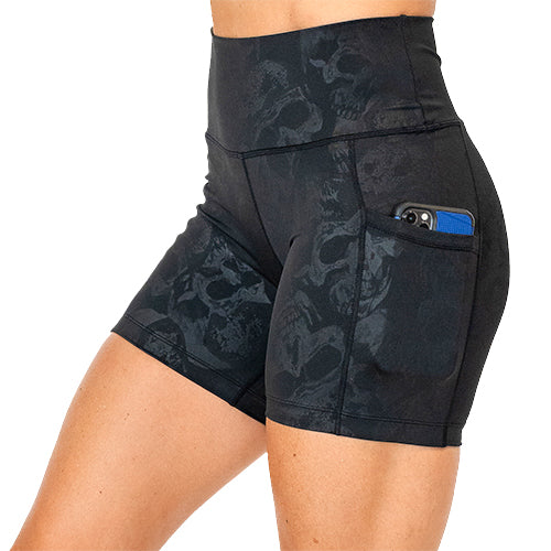 side pocket view of black on black skull print 5 inch shorts