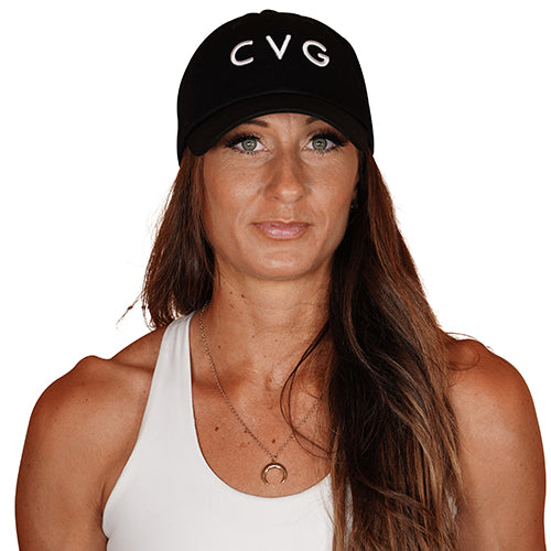 Photo of a model wearing a black snapback hat that has the CVG logo on the front