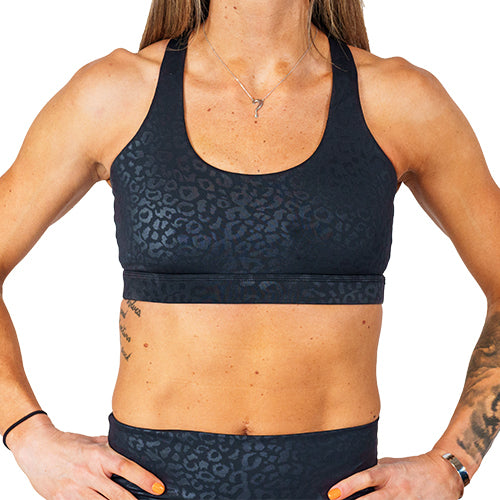 front view of black on black leopard print sports bra