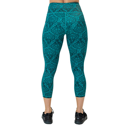 back view of capri length teal leggings with black elephant line pattern
