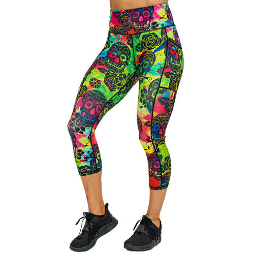 front view of capri colorful tie dye leggings with black skull pattern
