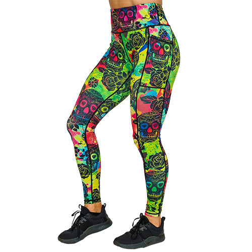 side view of full length colorful tie dye leggings with black skull pattern