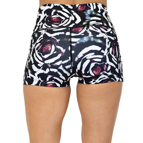 back view of blue, pink, white petal design on black 2.5" shorts