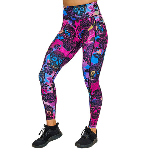 front view of full length purple, pink and blue tie dye leggings with black skull and rose pattern