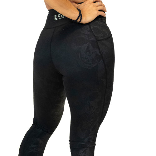 back view of black on black color skull print leggings
