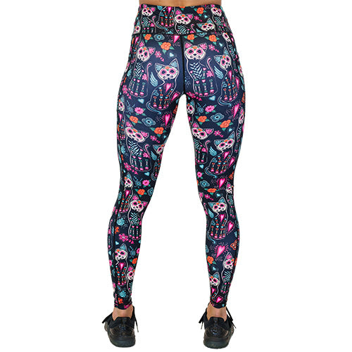 back view of full length cartoon skeleton cat print leggings