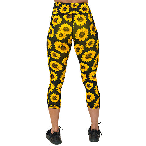 back view of capri length sunflower print leggings