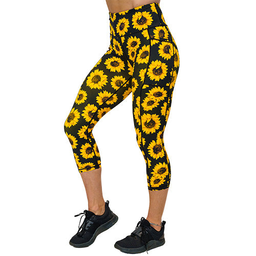 side view of capri length sunflower print leggings