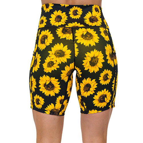 back view of yellow flower pattern on 7 inch shorts against a white background