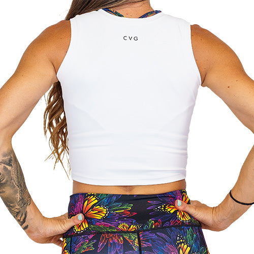 Close up photo of the back of a model wearing a white fitted crop top