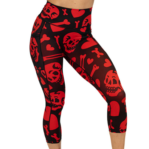 red and black leggings with skulls, bones and hearts