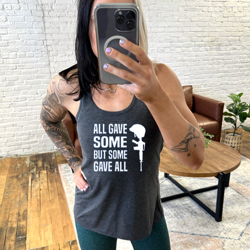 model wearing grey tank with the saying "all gave some but some gave all" in white