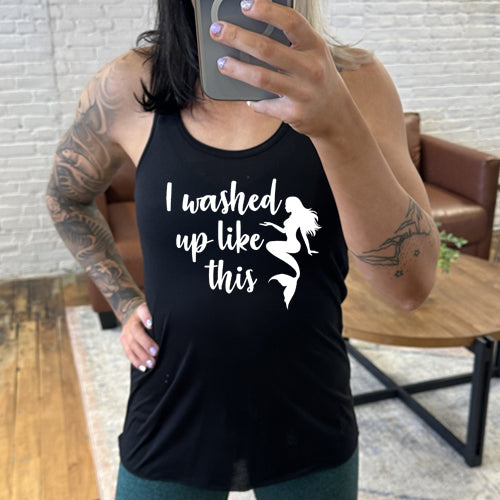 Model wearing a black racerback tank with the saying "i washed up like this" in white in the center