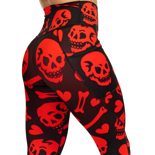 red and black leggings with skulls, bones and hearts