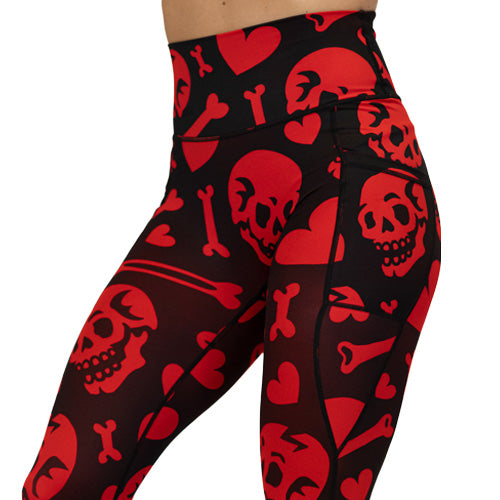red and black leggings with skulls, bones and hearts