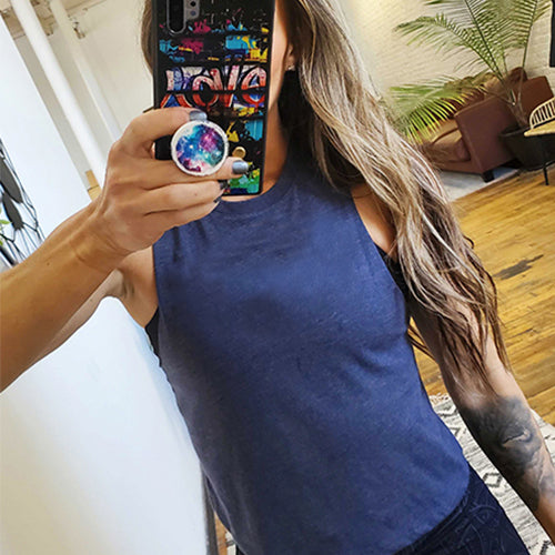 model taking a selfie of the blue waist length crop top