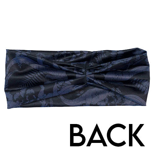 back of the black and grey dinosaur patterned headband