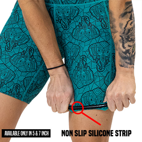 blue elephant outline shorts being rolled up to show the non slip silicon strip available in only the 5 and 7 inch shorts