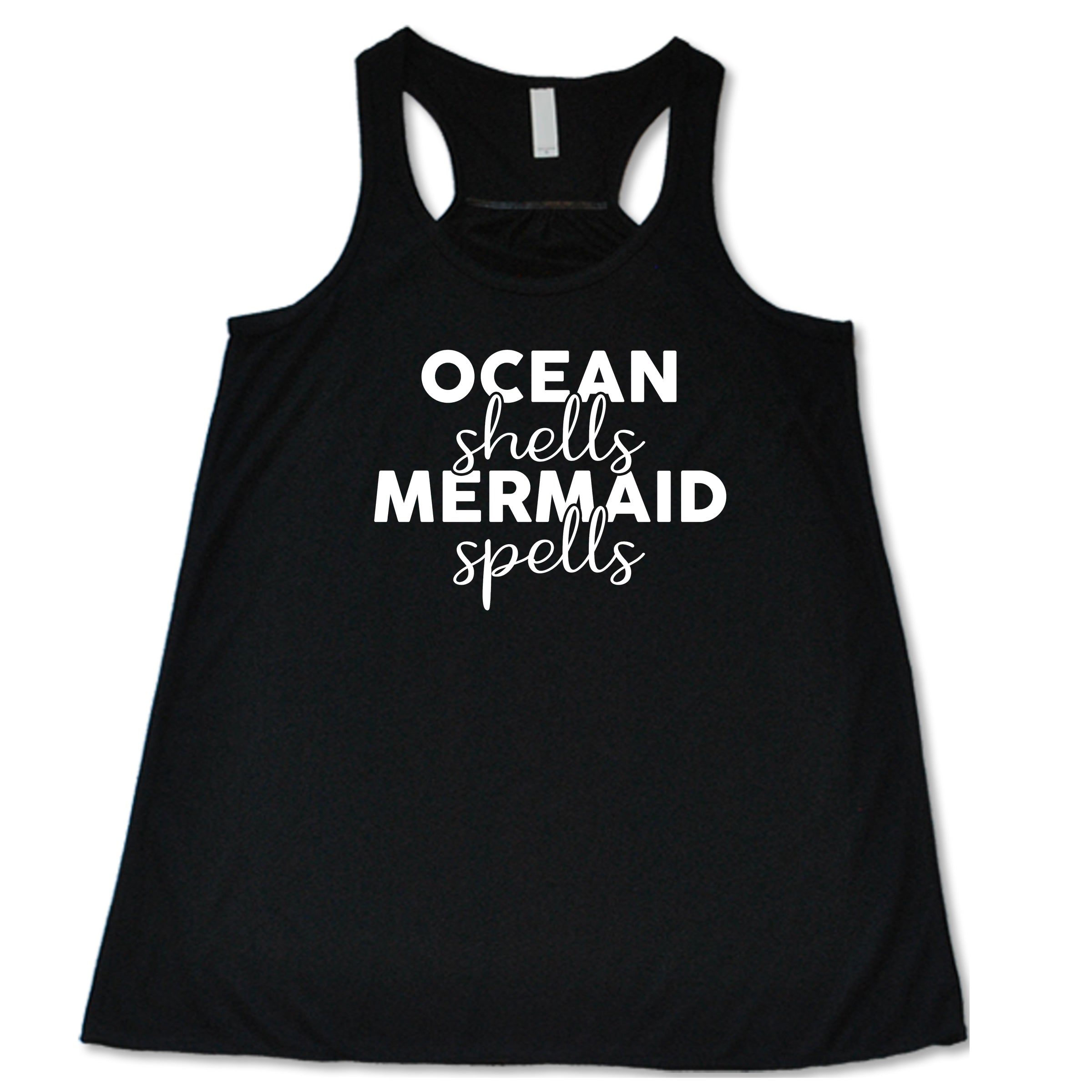 black racerback tank with the saying "ocean shells mermaid spells" in white in the center