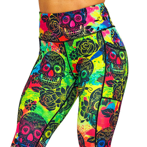 close up of colorful tie dye leggings with black skull pattern