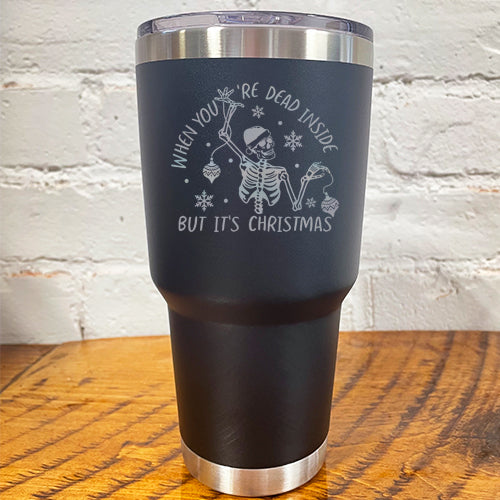 30oz black tumbler with silver saying "when you're dead inside but it's christmas" with a santa hat skeleton holding ornaments