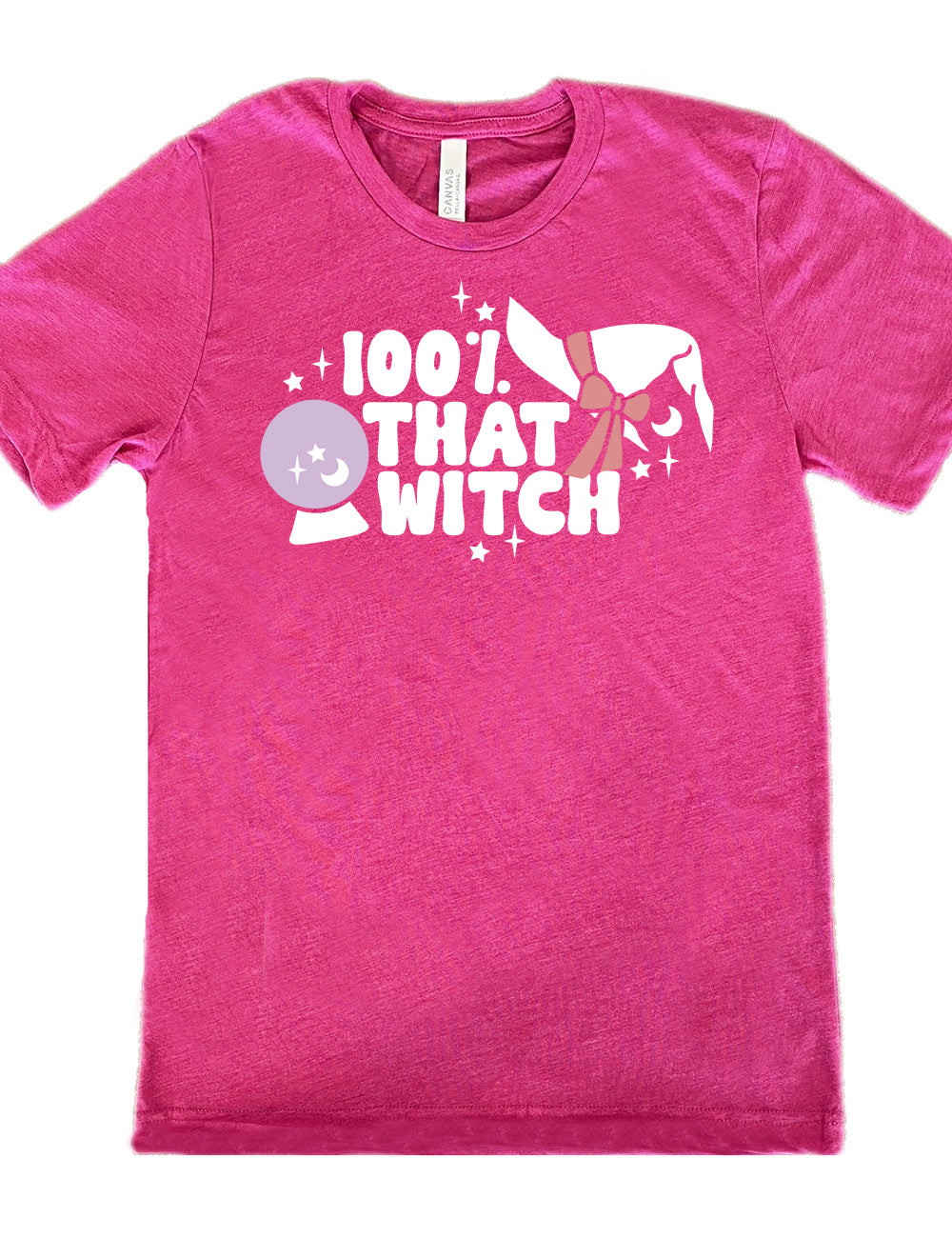 berry unisex tee with the words "100% that witch" next to the graphic of a witch hat with a bow, a crystal ball, and some stars