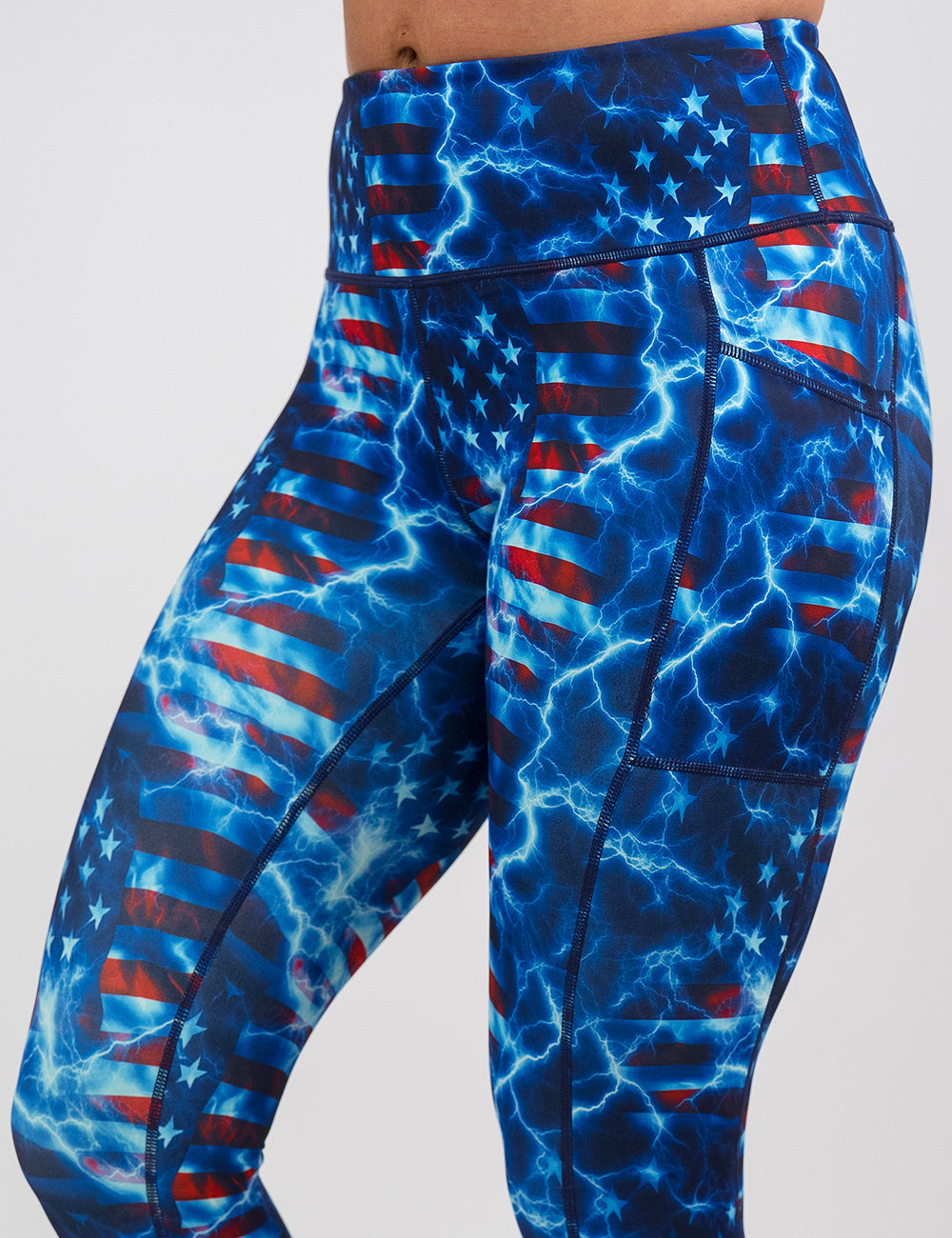 front of the front of the lightning flag leggings against a white background