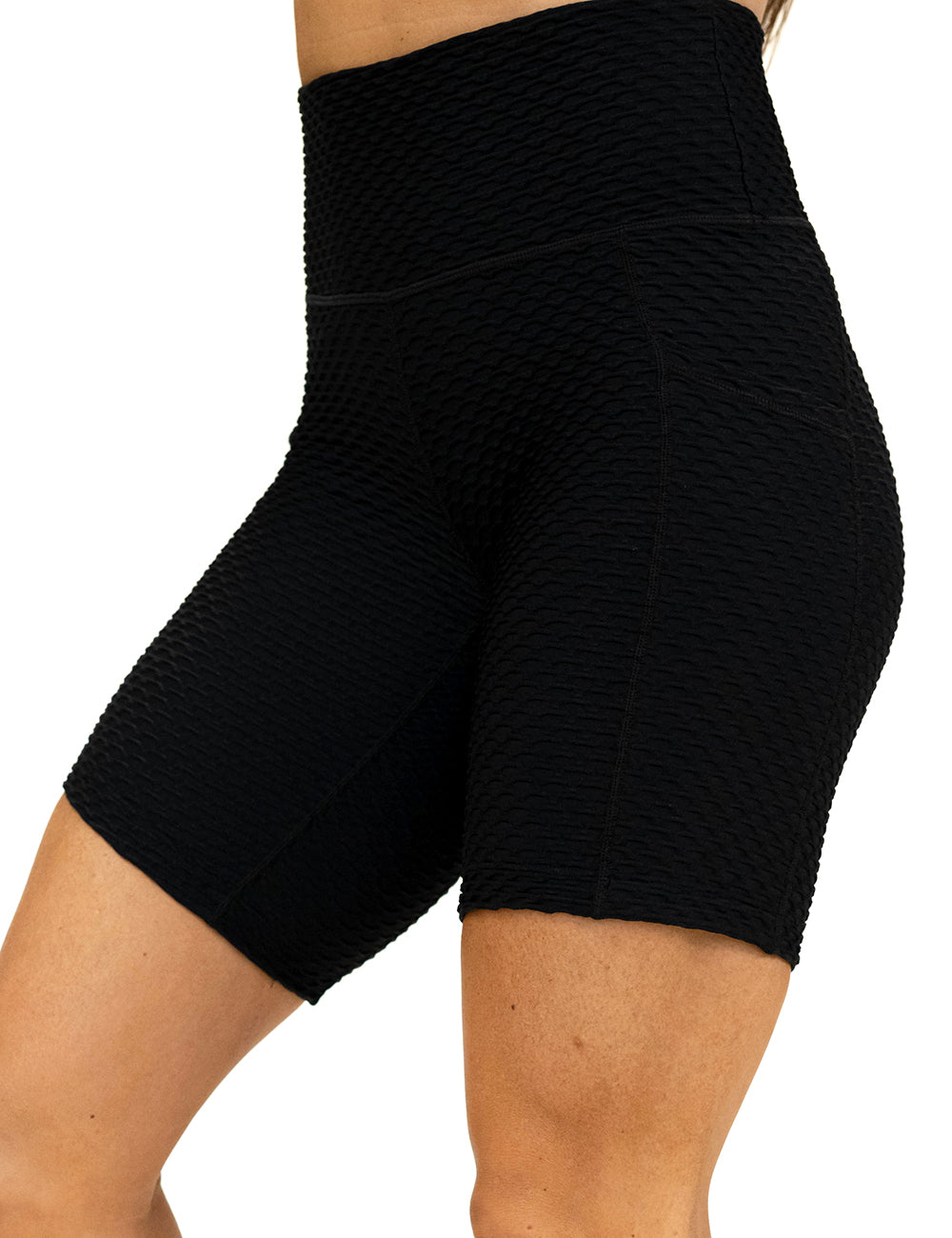 front of the 7 inch black waffled texture shorts against a white background