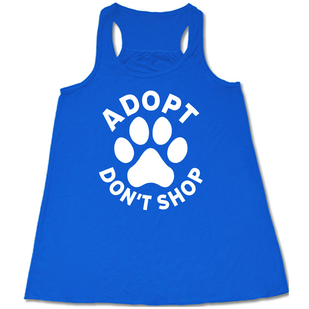 Blue colored flowy tank with paw print graphic on it that says "Adopt Don't Shop"