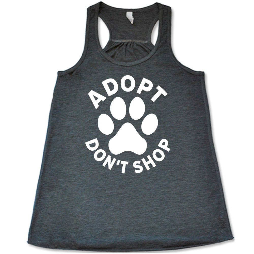 Grey colored flowy tank with paw print graphic on it that says "Adopt Don't Shop"