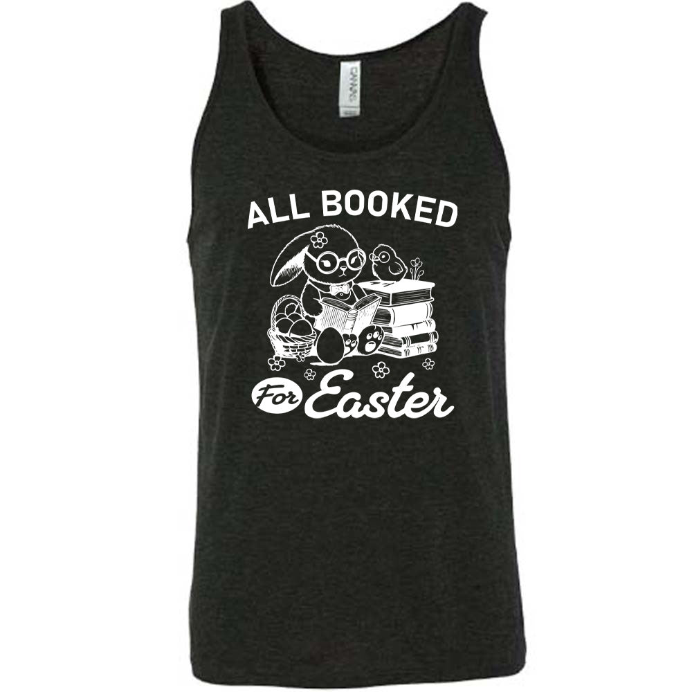 black unisex tank with the words "all booked for Easter" on it, and the graphic of a bunny wearing glasses and a bowtie, reading a book, next to a stack of books (with a bird wearing glasses on top of it) on one side, and a basket of eggs on the other side