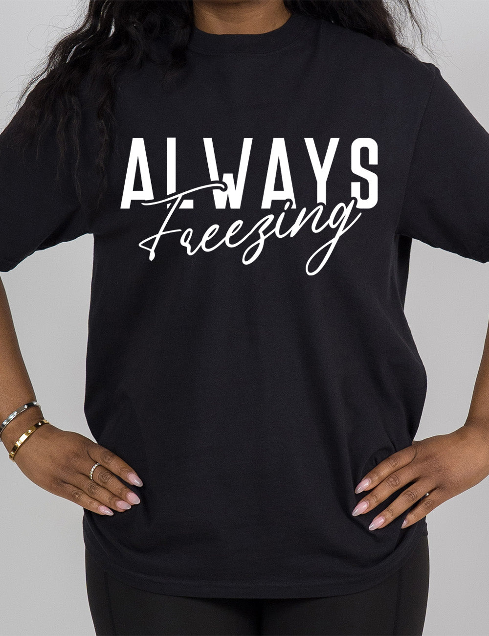 black modern tee with the word "always" in all capital letters with the word "freezing" in cursive, slightly overlapping it