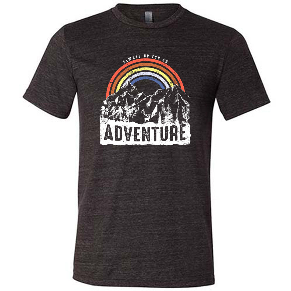 Black colored shirt with a rainbow over mountains graphic on it that says "Always Up For An Adventure"
