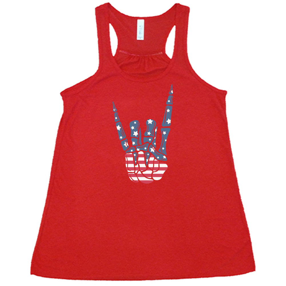 Red colored flowy tank with an American flag skeleton hand graphic on it