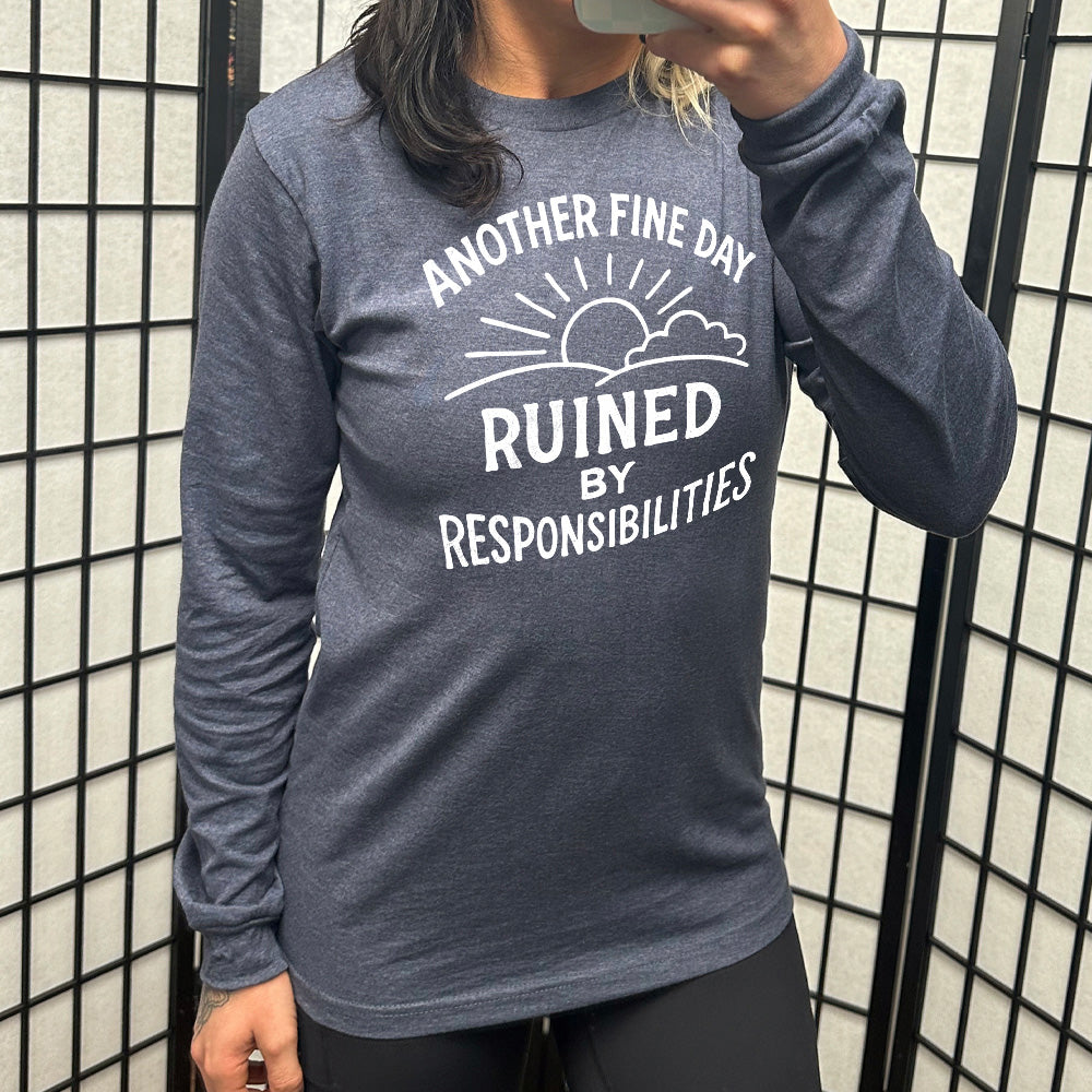 heather navy long sleeve shirt  with wording "Another Fine Day Ruined By Responsibilities" in white lettering, with a sunrise graphic