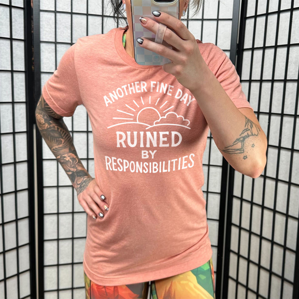 Sunset Unisex Tee, with wording Another Fine Day Ruined By Responsibilities in white lettering, with a sunrise