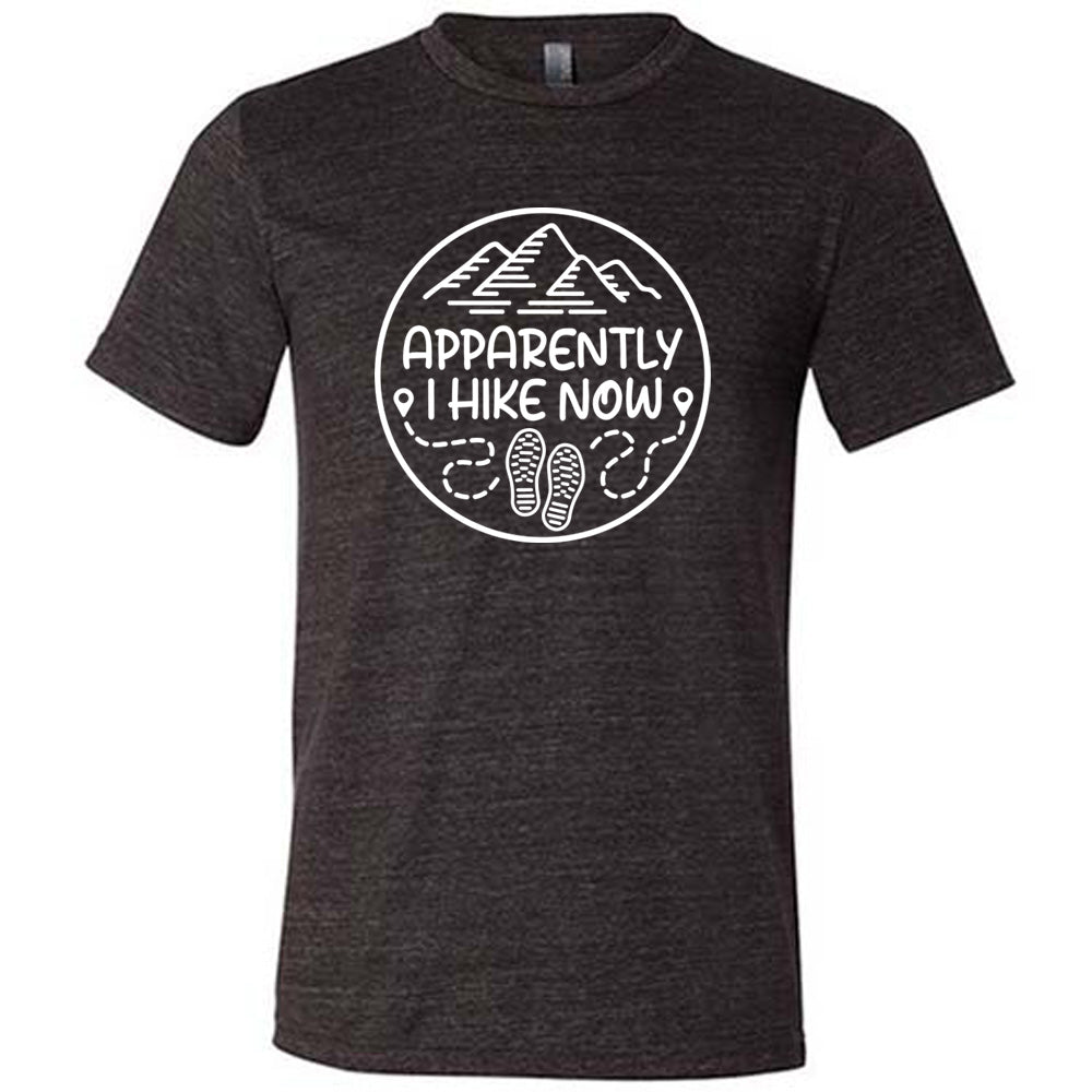 Black colored shirt with a mountain and shoes graphic on it that says "Apparently I Hike Now" 