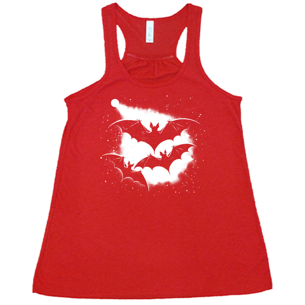 Red colored flowy tank with bats silhouette graphic on it