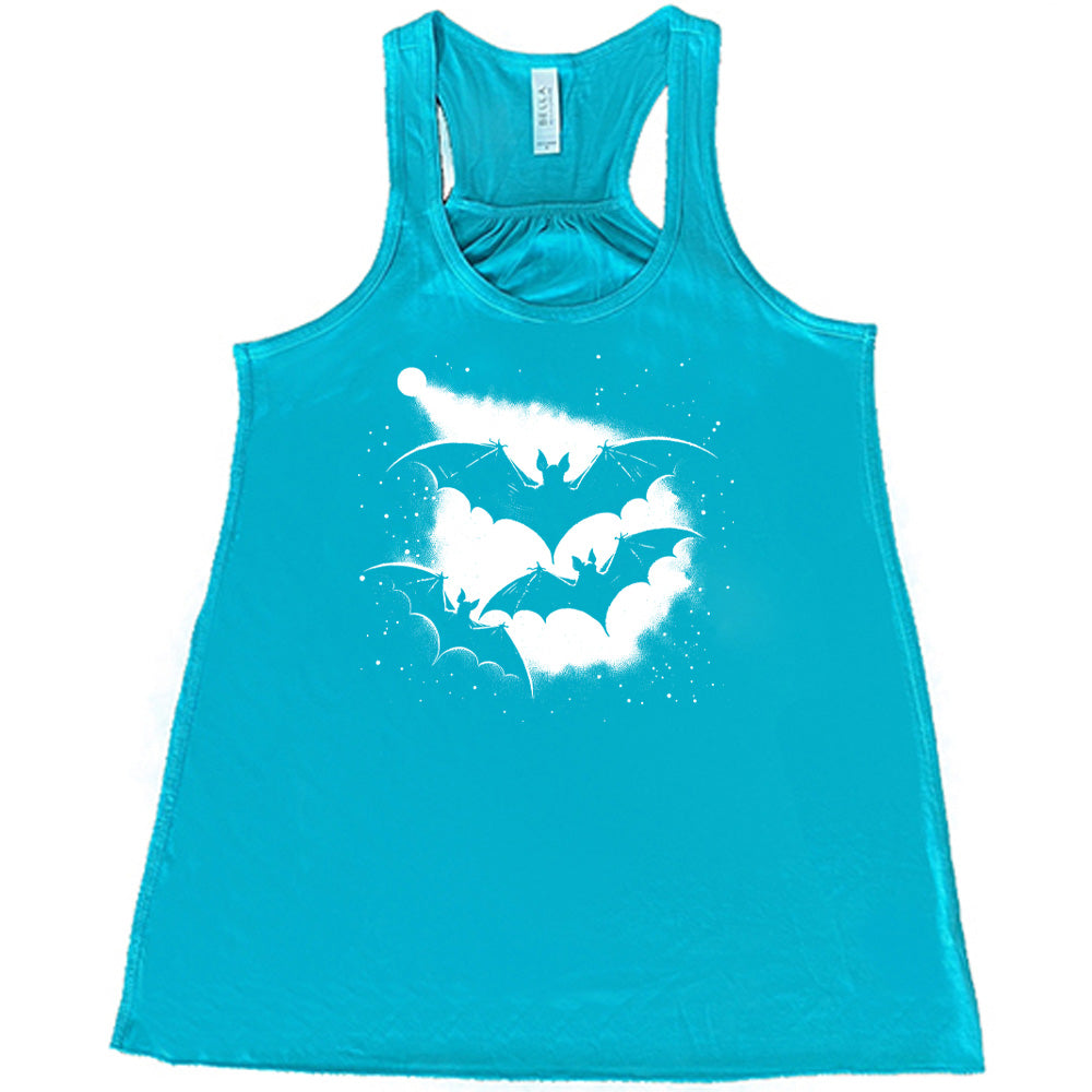 Teal colored flowy tank with bats silhouette graphic on it