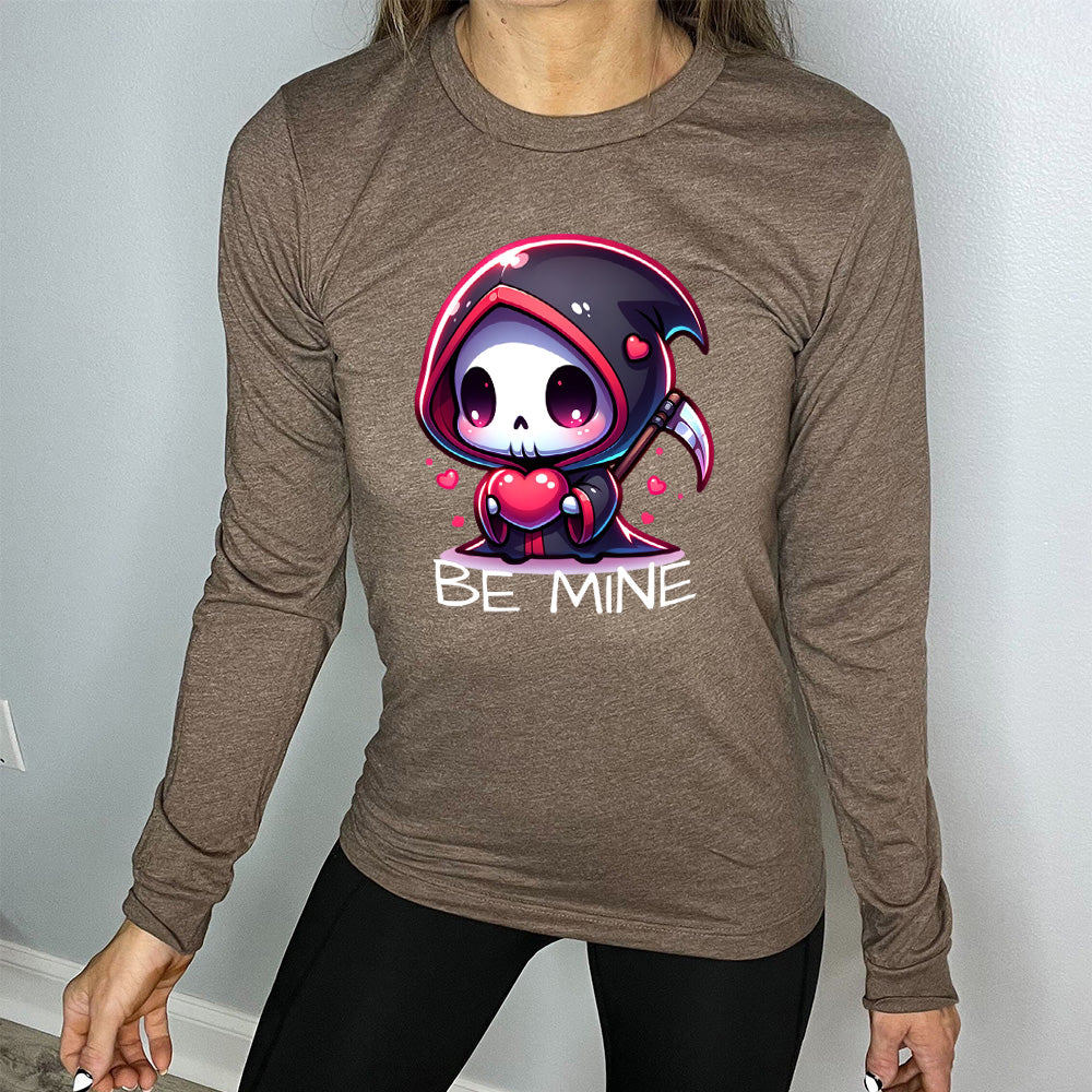 heather brown long sleeve with large graphics of a cartoony grim reaper holding a heart, with little hearts surrounding, and the words "be mine" on it