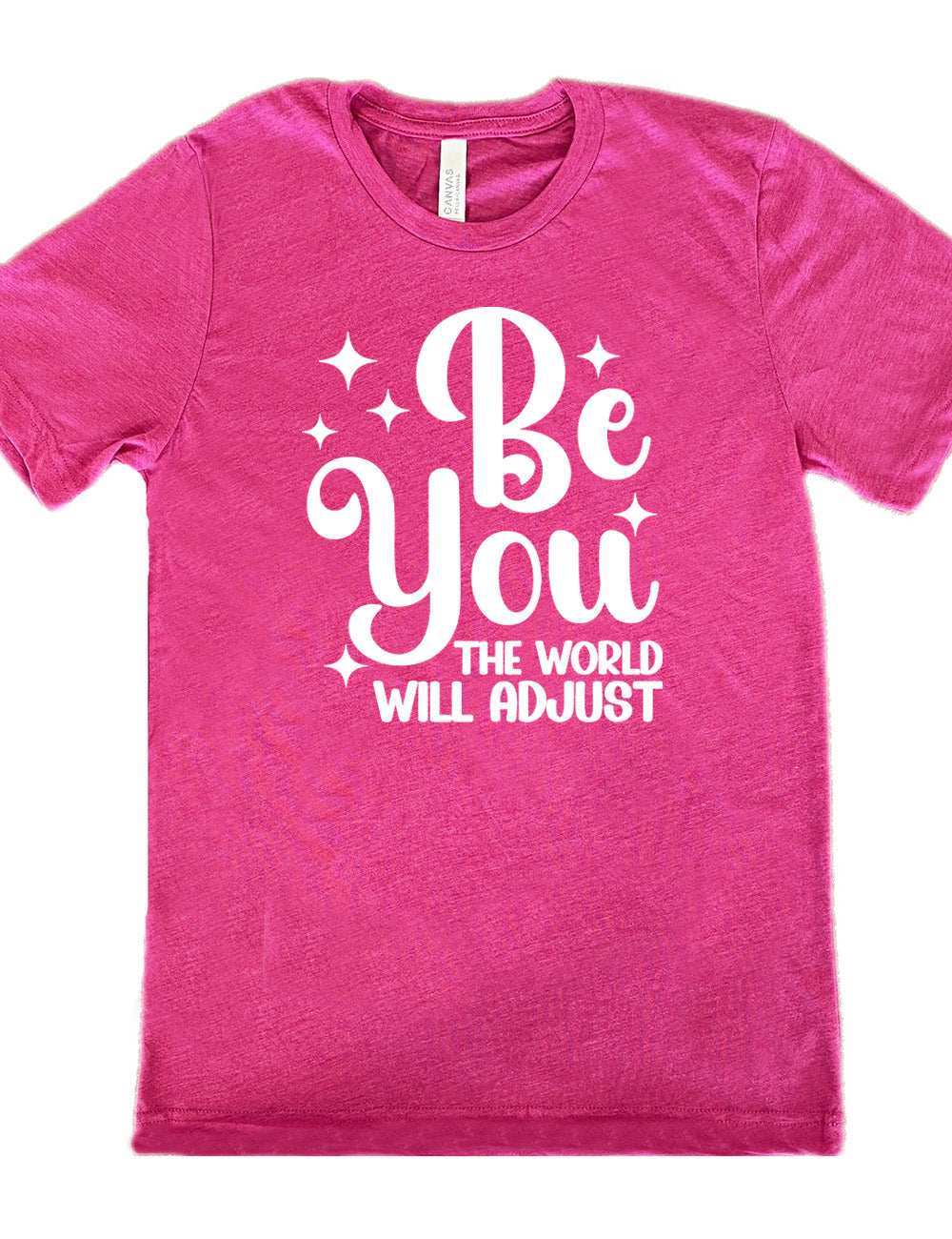 berry unisex tee with the words "be you" in big letters, surrounded by a few little stars, followed by the words "the world will adjust" underneath