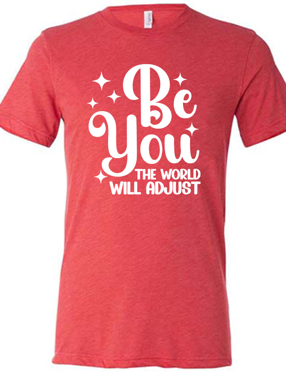 red unisex tee with the words "be you" in big letters, surrounded by a few little stars, followed by the words "the world will adjust" underneath