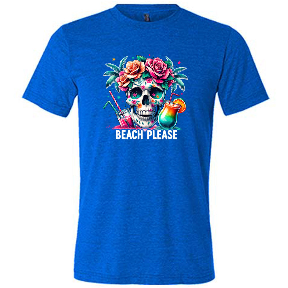 Blue colored shirt with a flowery skull and drinks graphic on it that says "Beach Please" 