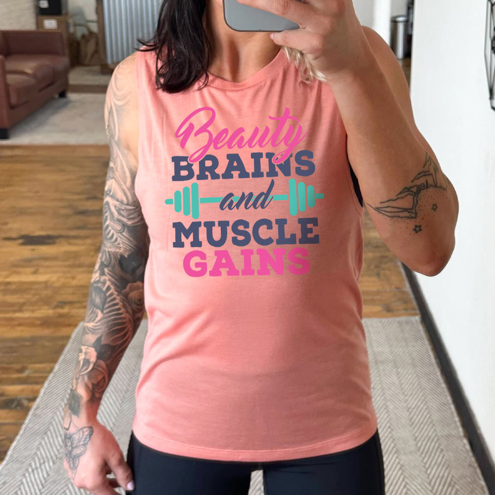 Peach Muscle Tank, with wording Beauty Brains and Muscle Gains, with a barbell