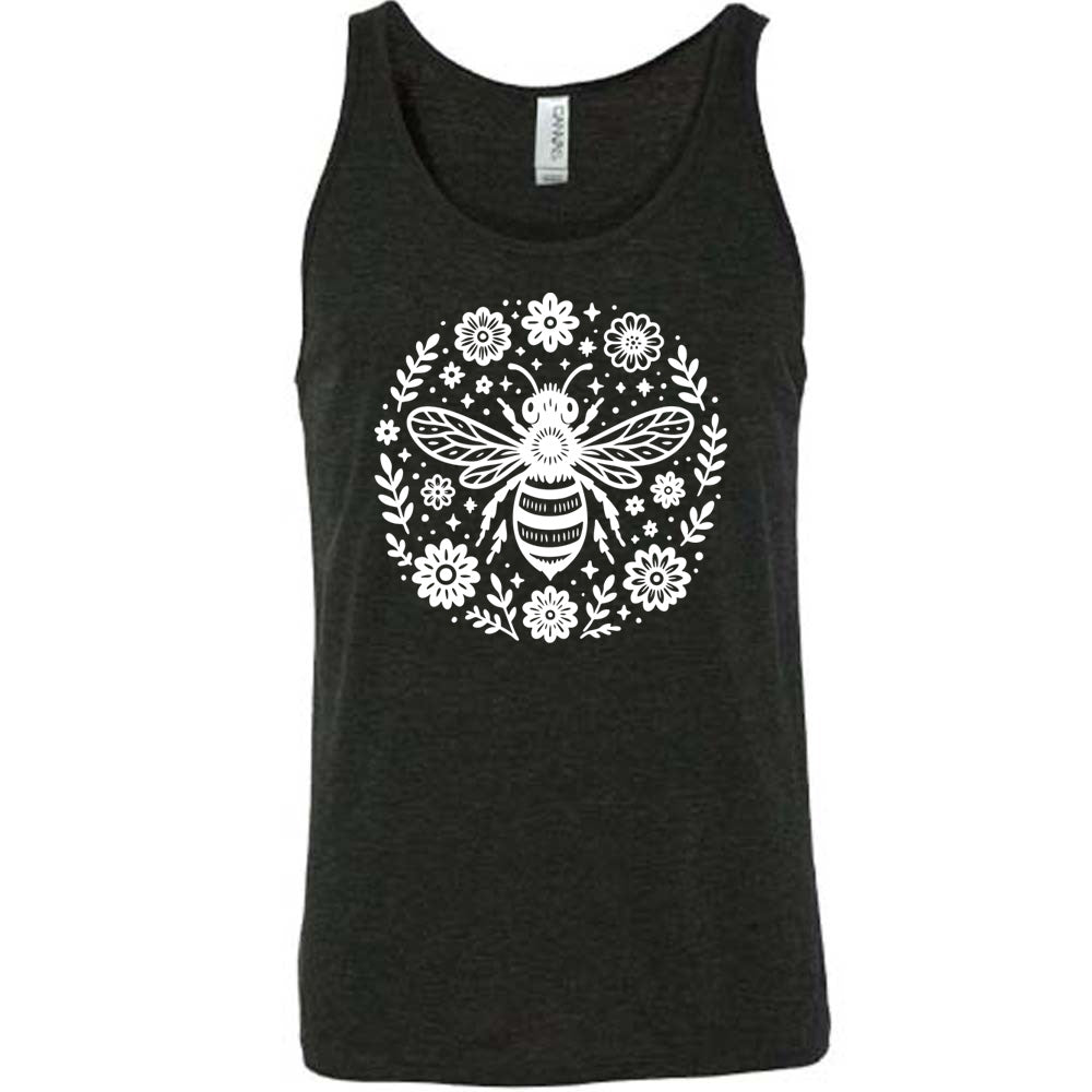 black unisex tank with the graphic of a boho circled design filled with flowers of varied size, some branches, some stars, and in the center a fancy bee
