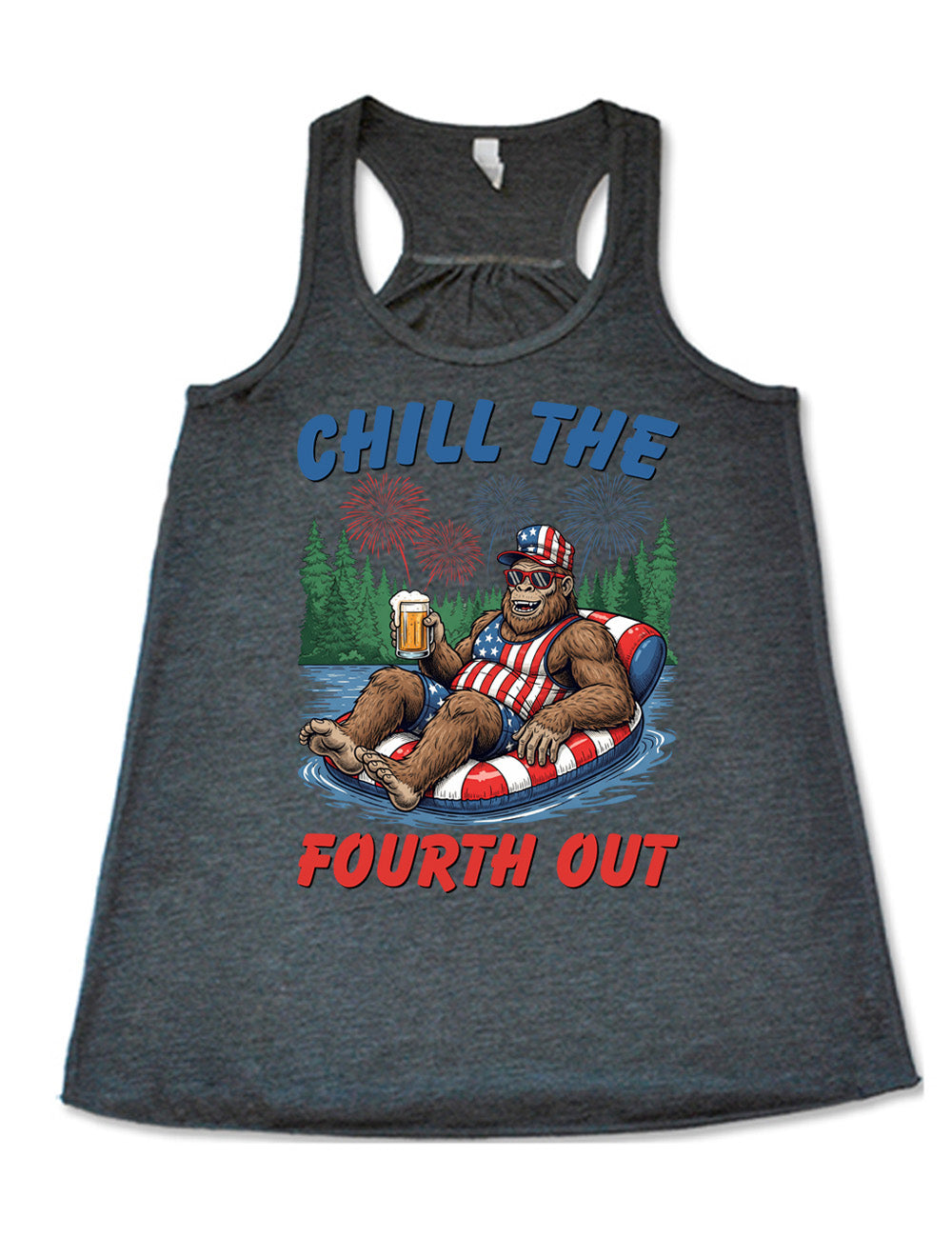 grey flowy racerback tank with the graphic of a grinning Bigfoot holding a beer, wearing sunglasses and an American flag outfit, in an American flag tube, in the water, with a background of trees, with fireworks above, and the words saying "chill the fourth out" on it