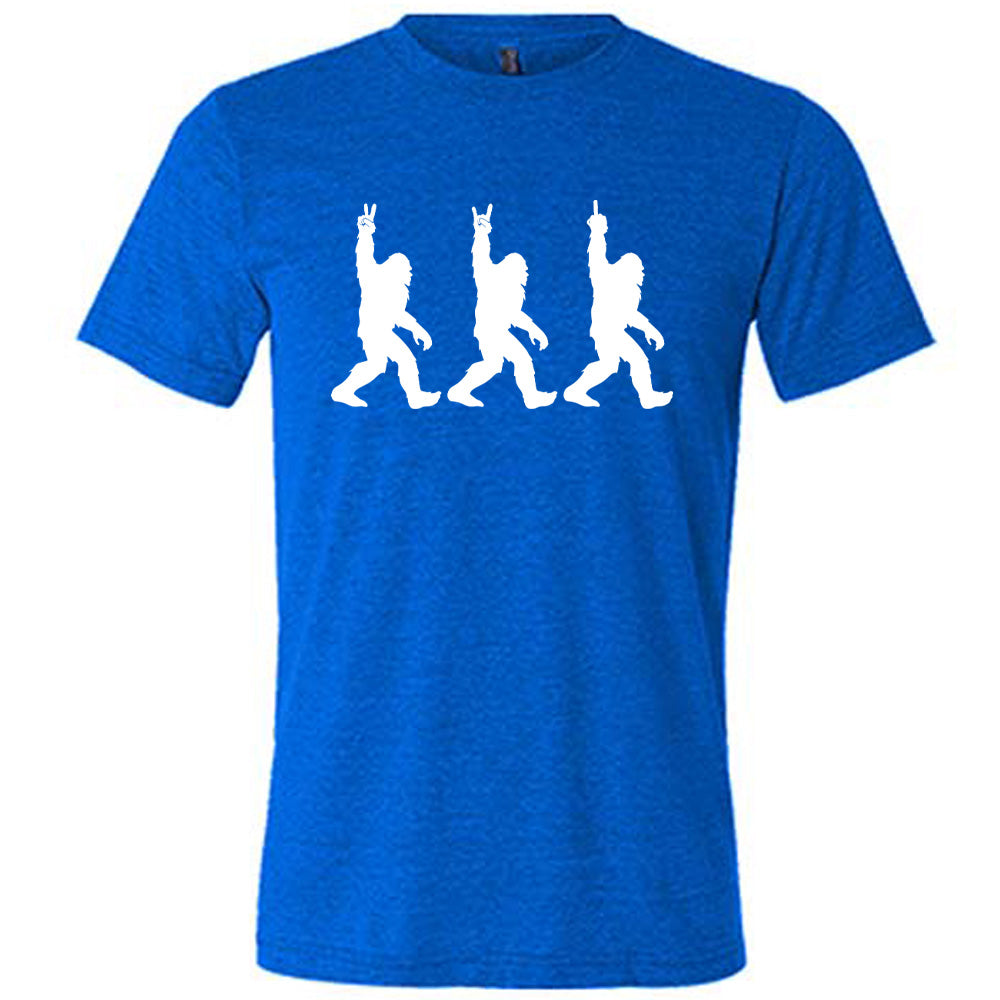 Blue colored shirt with bigfoot doing peace sign graphic on it